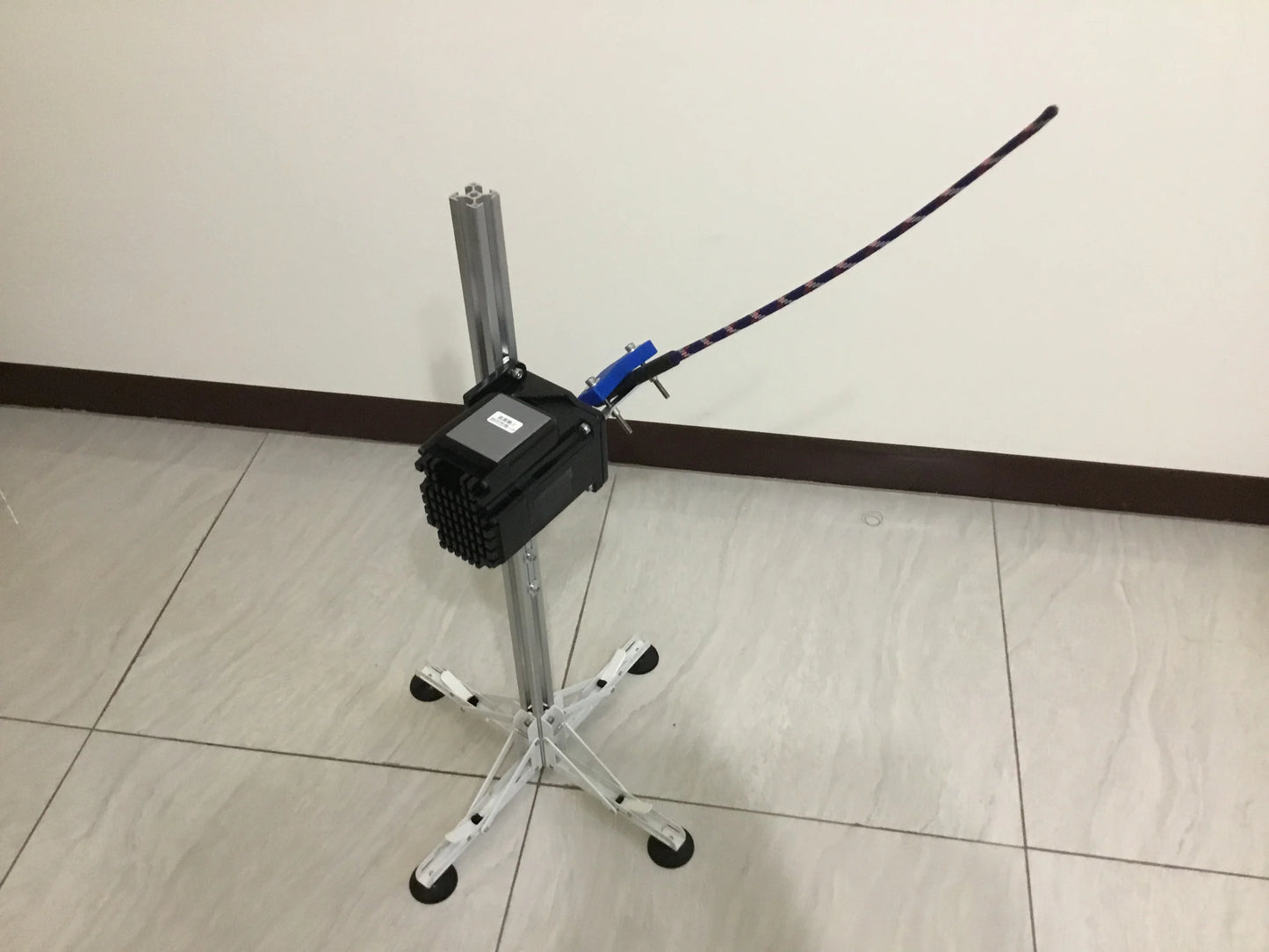 Adjustable intensity electronic massage tool with an extended flexible whip attachment.